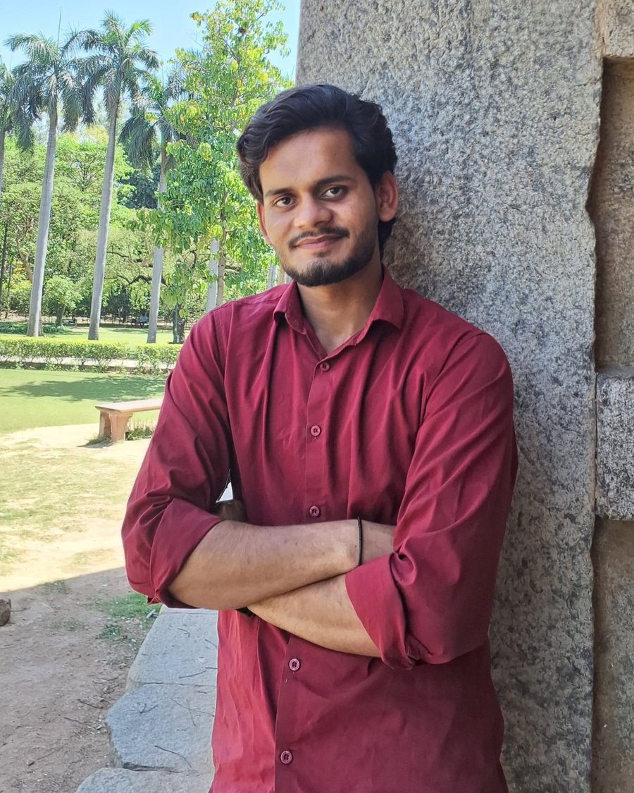 Puneet Raghav, founder of AI Vidyapeeth, standing with arms crossed in a garden